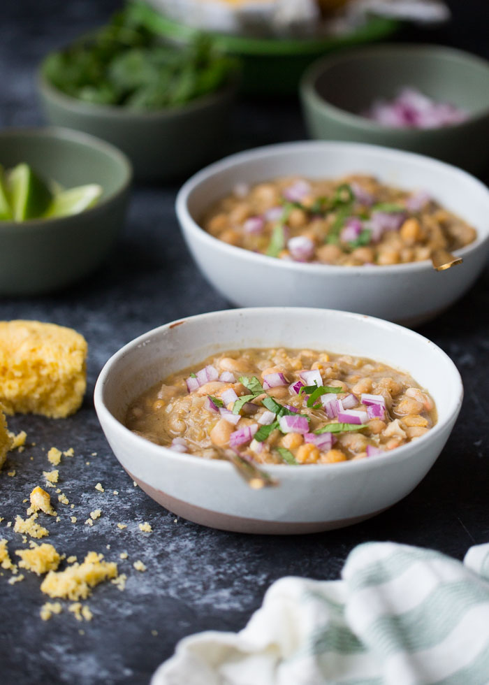 20-Minute Vegetarian White Bean Chili - I'm always surprised by how complex this tastes considering it only takes 20 minutes! Three kinds of beans add interest to this simple (and fast) vegetarian/vegan white bean chili recipe. A weeknight go-to around here! #whitebeanchili