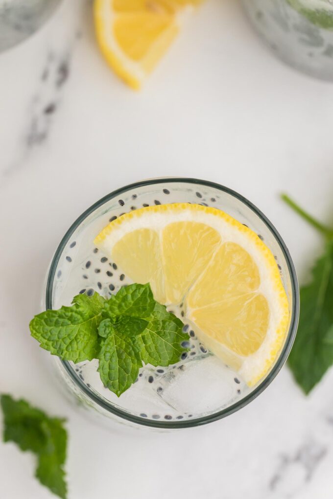 top view of lemon basil seed drink with lemon garnish