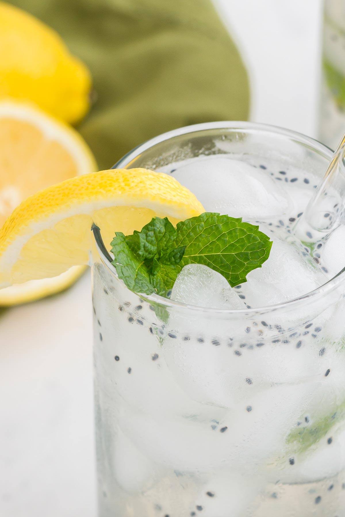 lemon basil seed drink with ice, mint, and lemon sedge