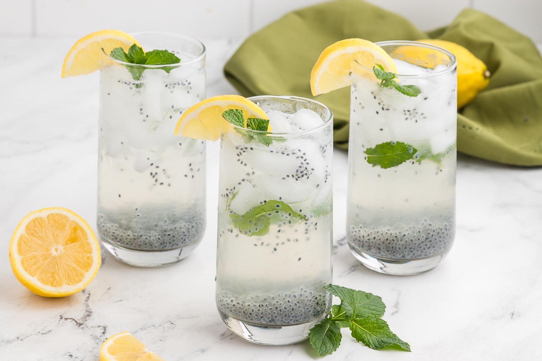 glasses full of basil seed drink on a white background