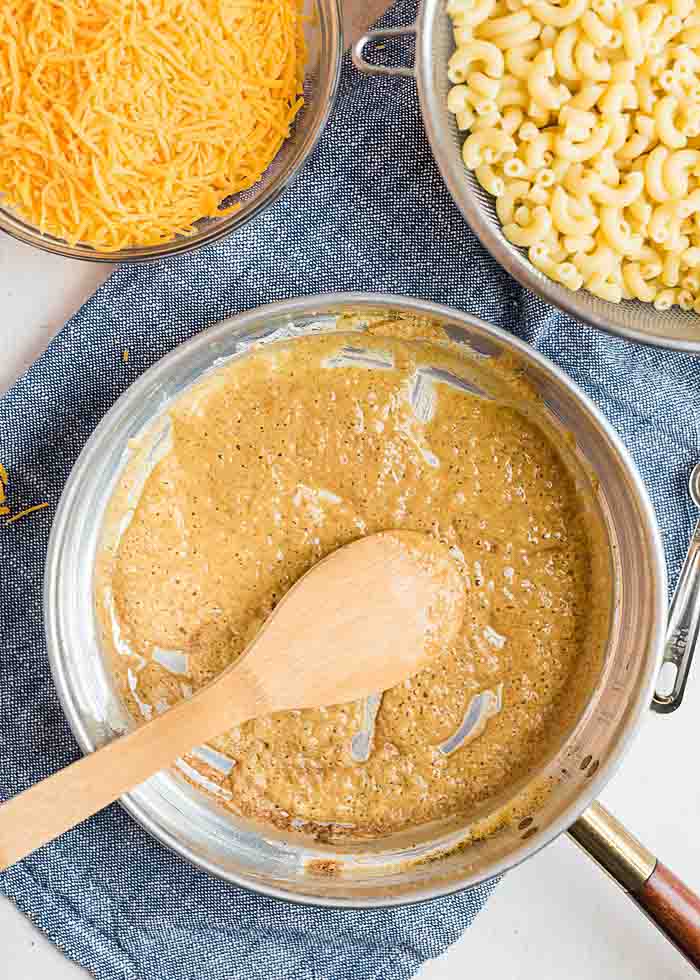 Cooking the roux for the best baked macaroni and cheese recipe ever