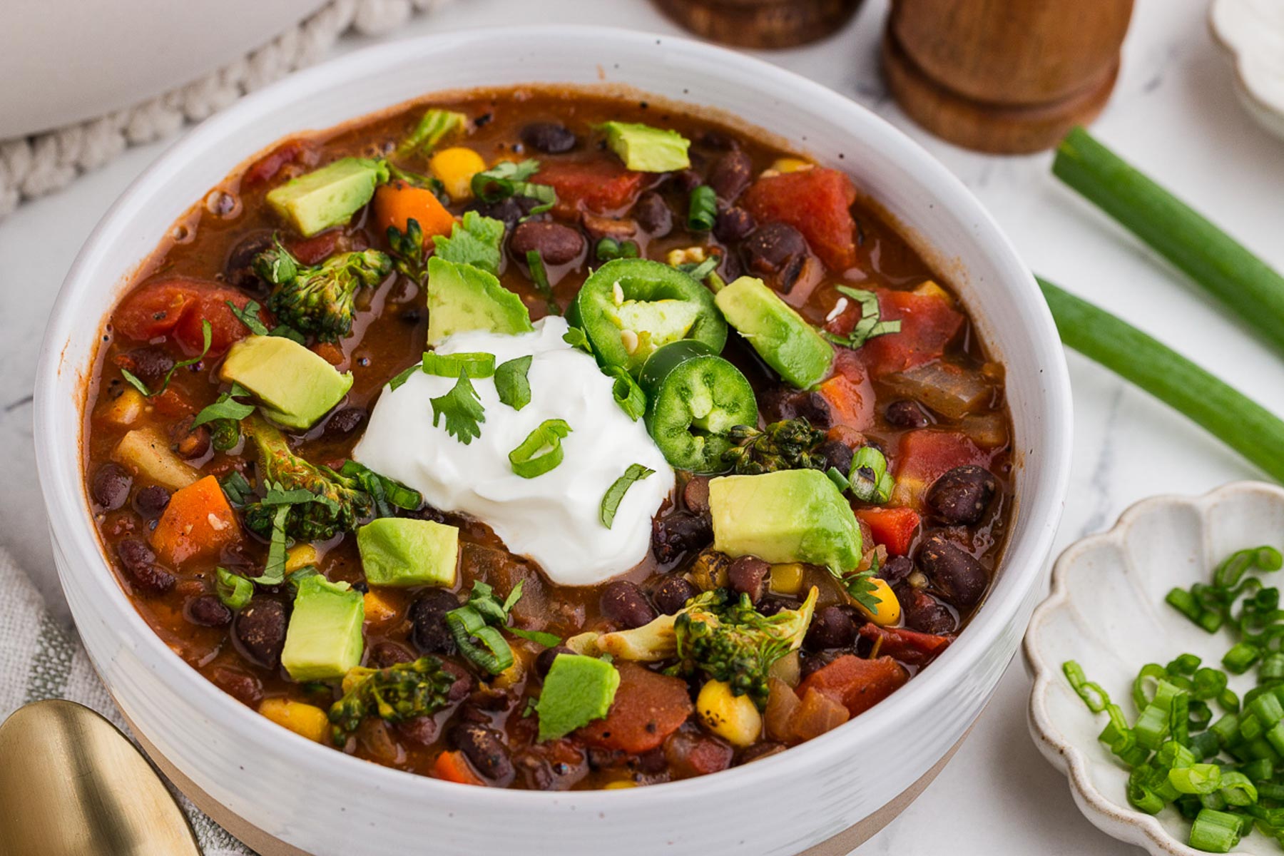 A white bowl full of Black Bean Veggie Chili