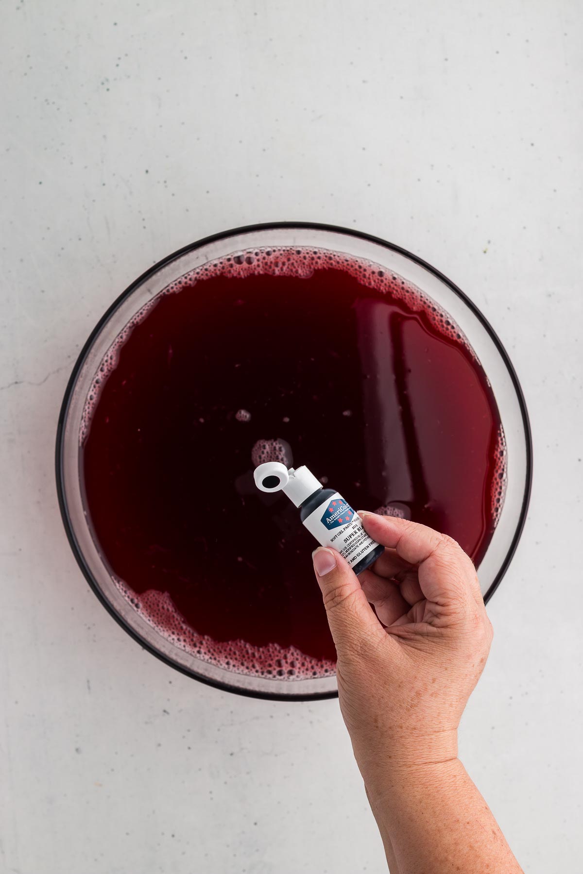 Adding black food coloring to Black Magic Halloween Punch