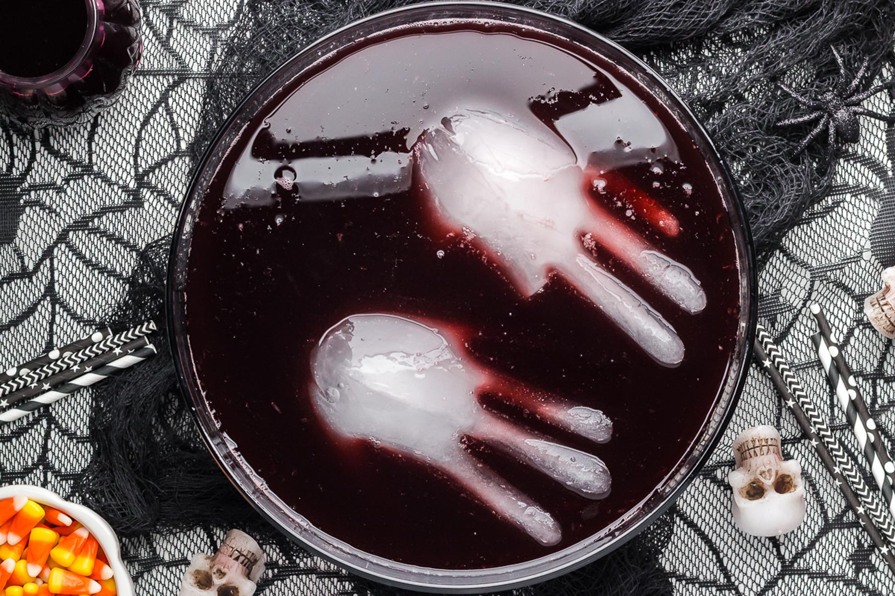 Top view of Black Magic Halloween Punch with ice hands