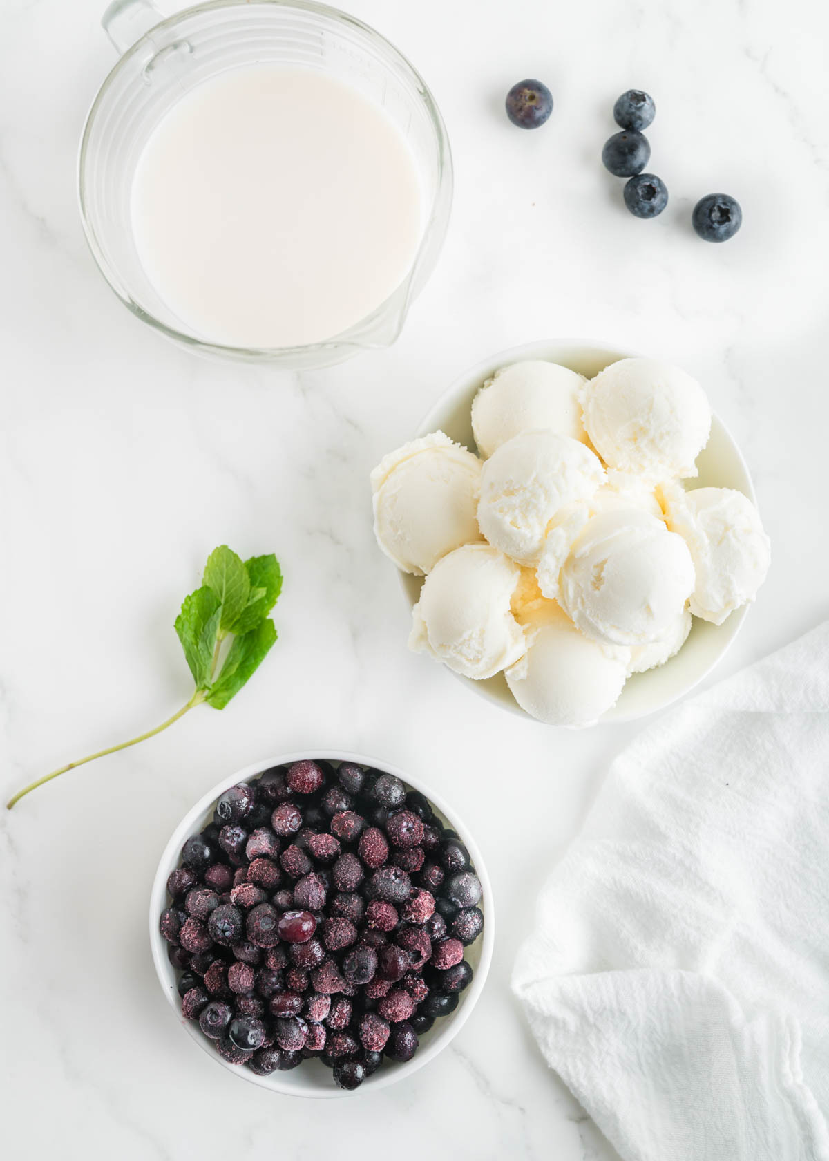 Ingredients for blueberry milkshakes include blueberries, ice cream, and milk.