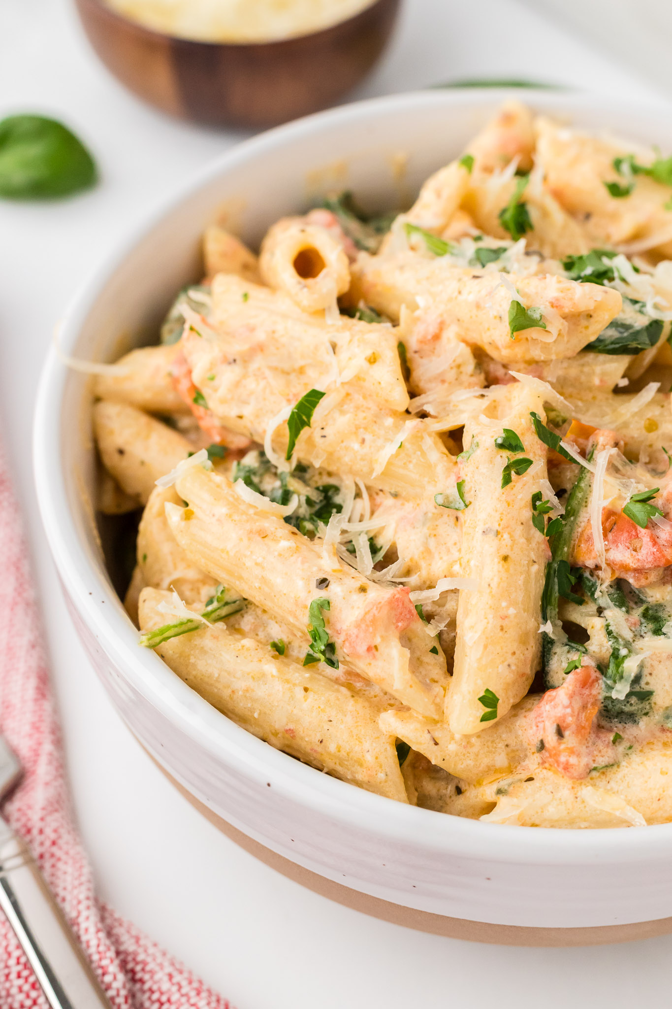 A white bowl full of Boursin pasta.