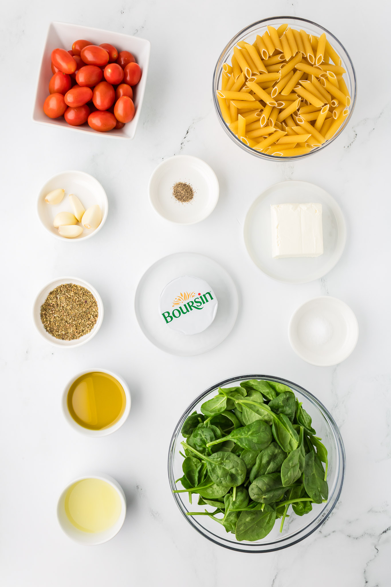 Ingredients for Bourin pasta include cherry tomatoes, pasta, seasonings, Boursin cheese, cream cheese, olive oil, and spinach