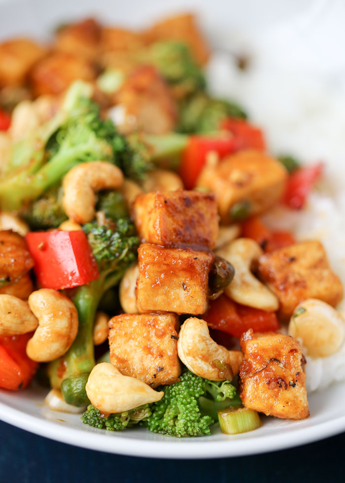 One Dish Two Ways: Cashew Veggie Stir Fry with tofu or chicken. Crisp veggies, crunchy cashews, and tofu for the vegans and chicken for the meat-eaters - all in a savory-sweet, slightly spicy sauce. This recipe cooks up in two pans at the same time, so the process can be a bit hectic. But it's well worth the effort!