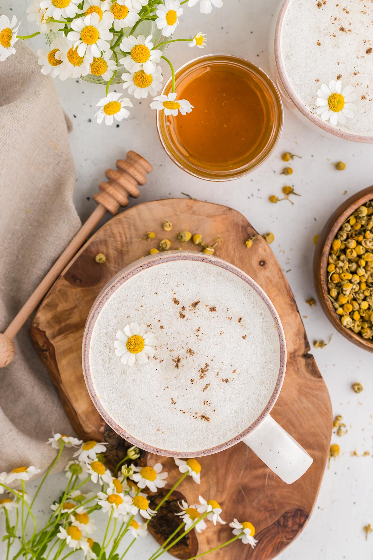 Top view of chamomile latte on a wooden board