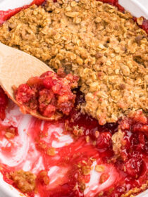 cherry crumble with a wooden spoon