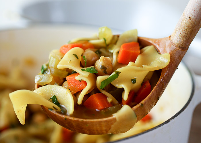 A ladleful of chickpea noodle soup.