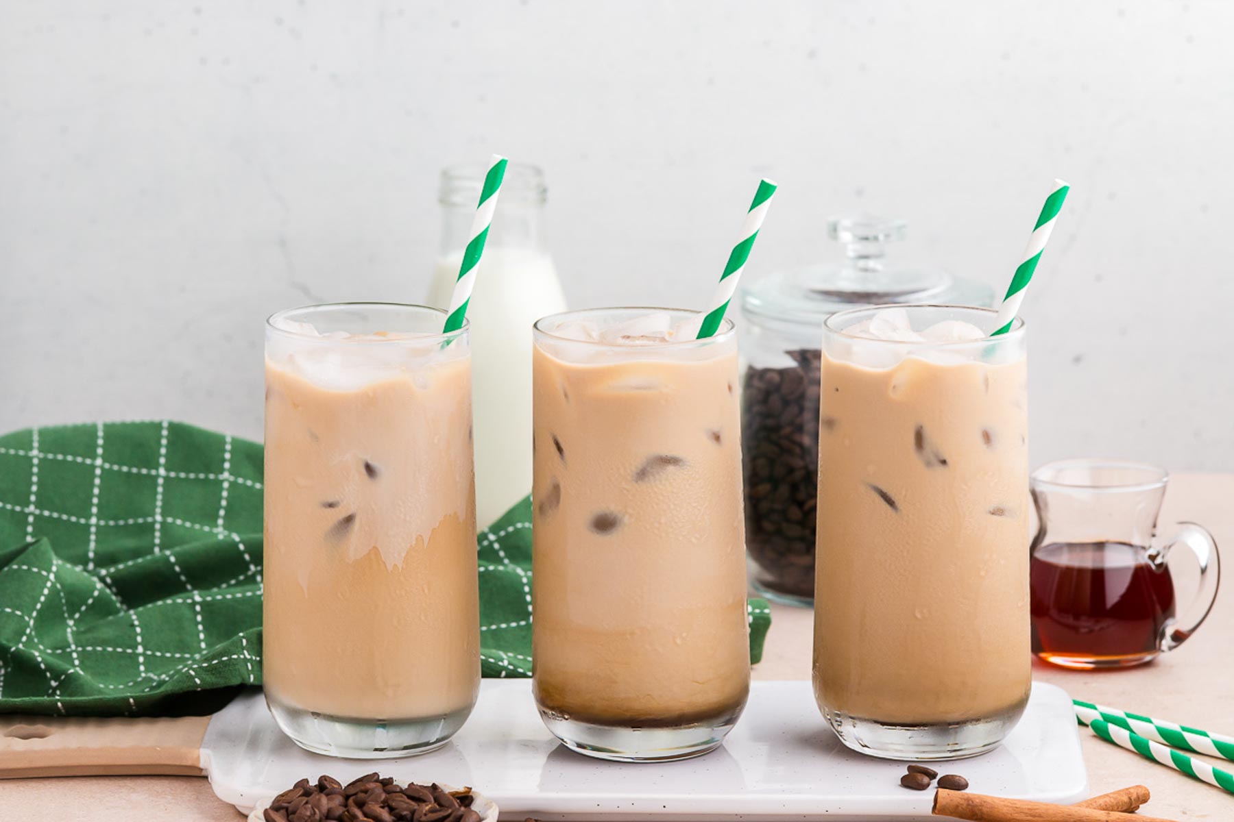 Three glasses of cinnamon dolce iced coffee in a row