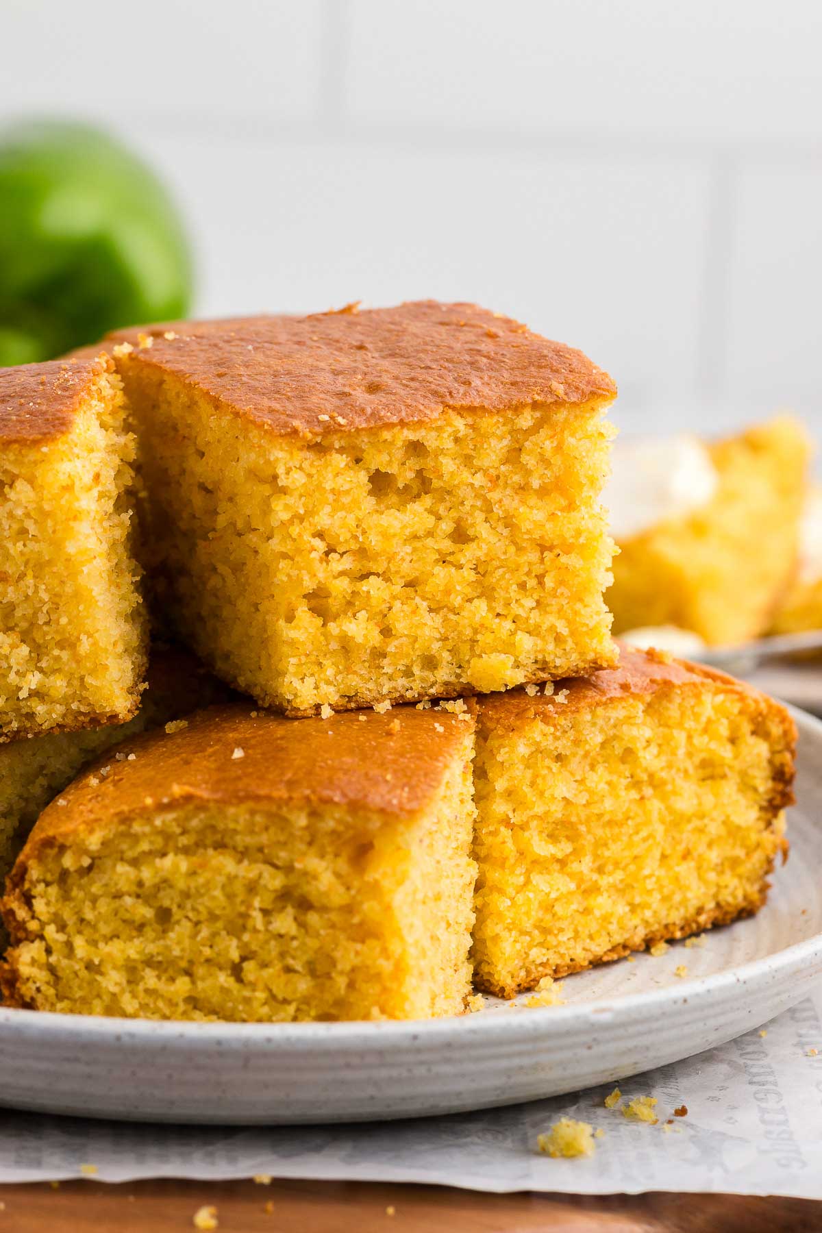 stack of Homemade Cornbread on a white plate
