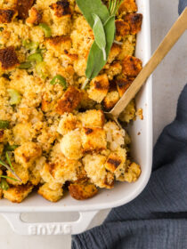 A spoon scoops out cornbread stuffing