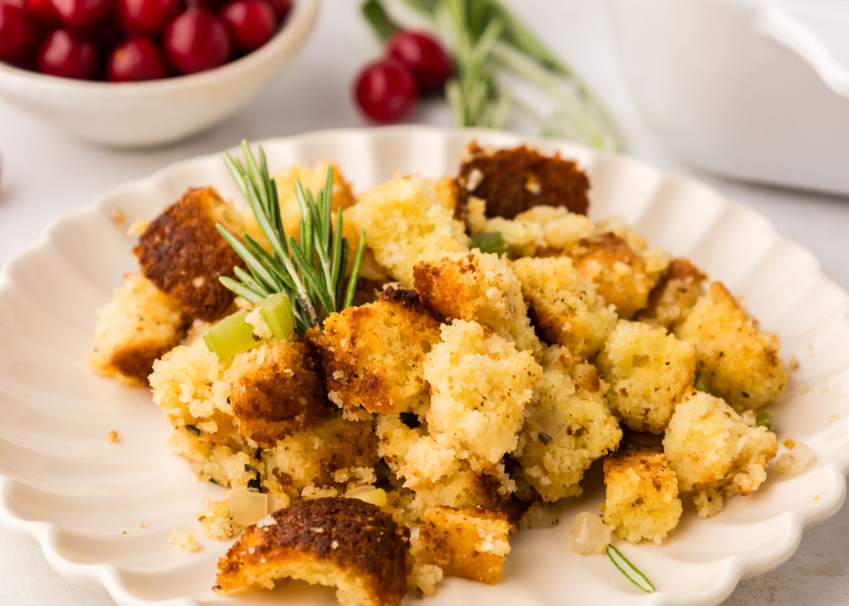 A white plate full of cornbread stuffing.