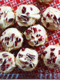 Cranberry Bliss Muffins - Inspired by the famous Starbucks bars, these cream-cheese frosted muffins are studded with cranberries and white chocolate. The perfect breakfast treat for the holidays!
