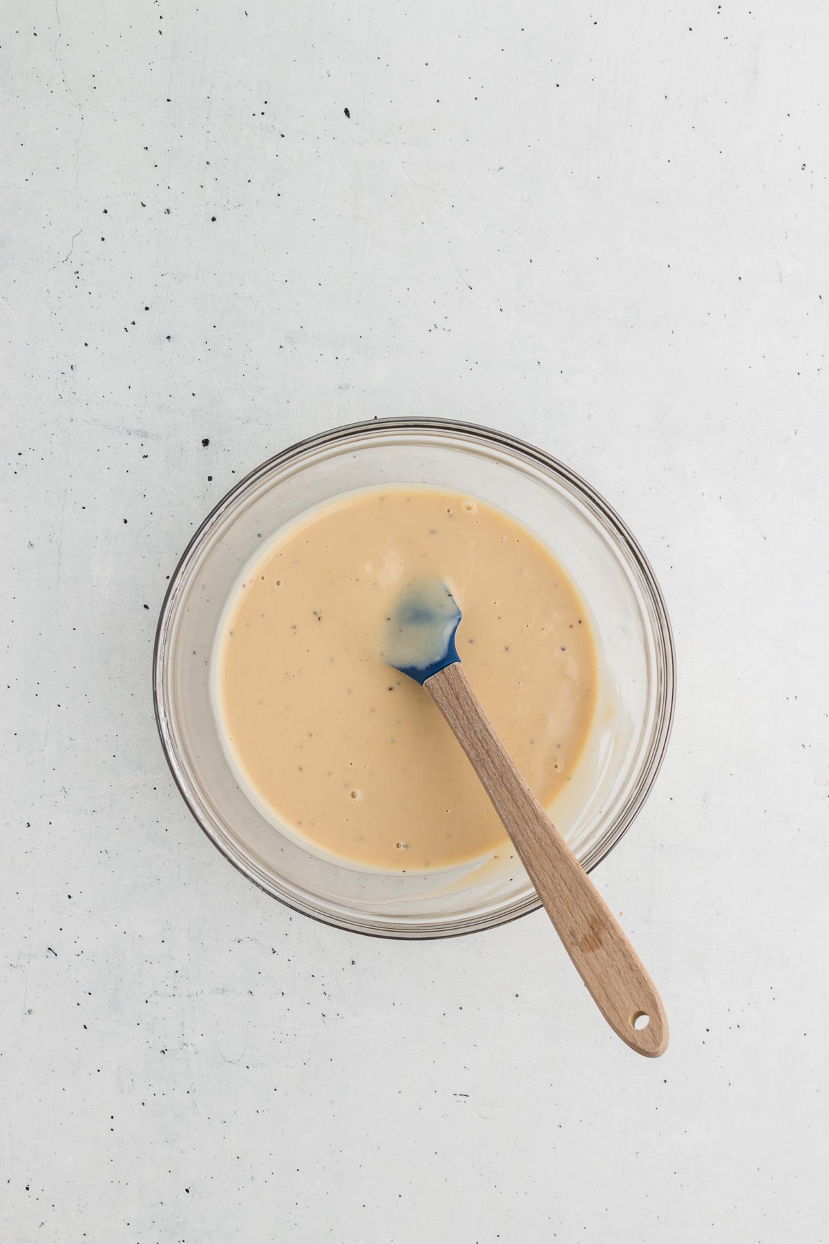 Mixing together tahini dressing