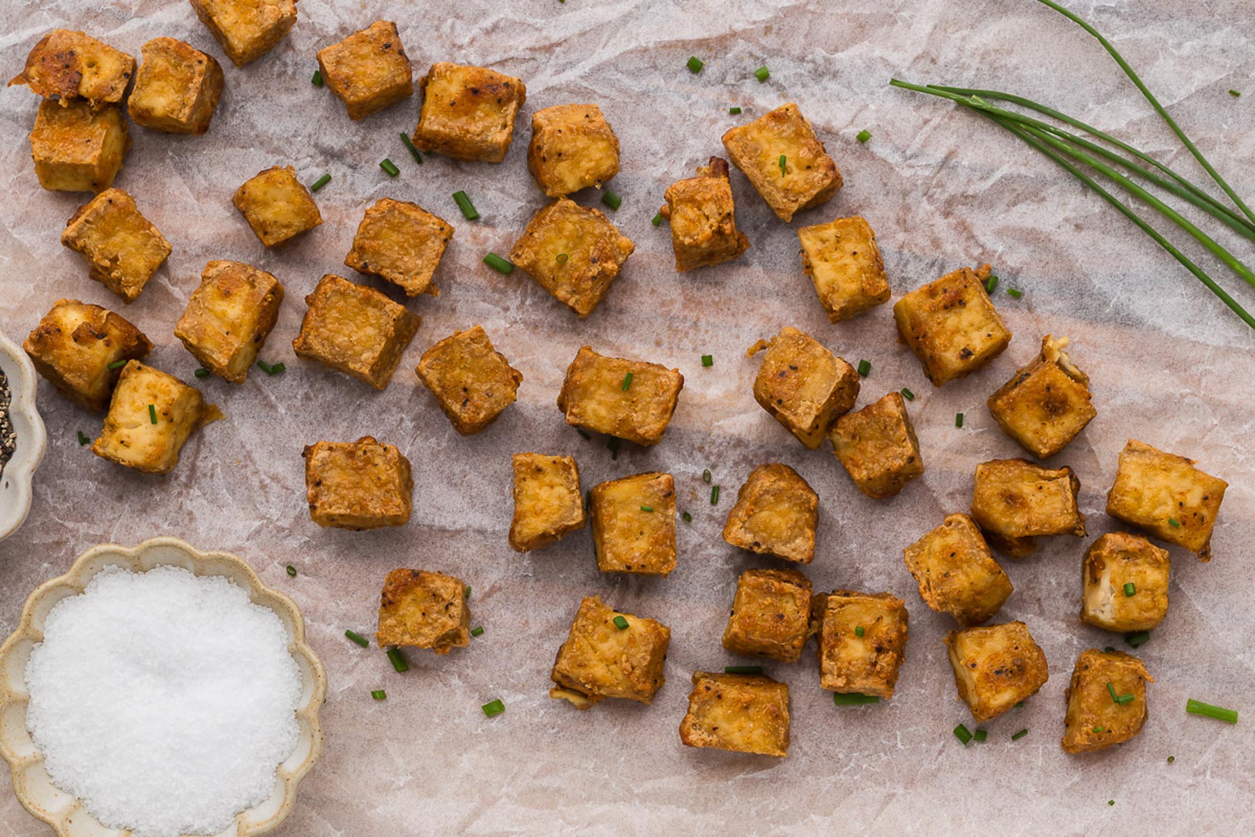 Crispy Air Fryer Tofu with a dish of coarse sea salt