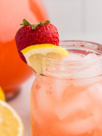 Easy Strawberry Lemonade with a strawberry and lemon wedge