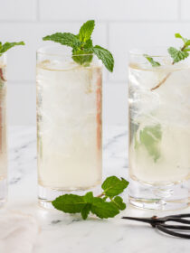 fresh mint tea with sprigs of fresh mint and herb scissors.