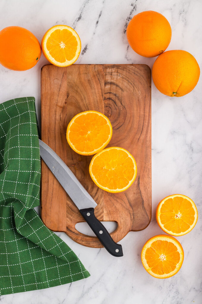 Oranges sliced in half and ready for fresh squeezed orange juice