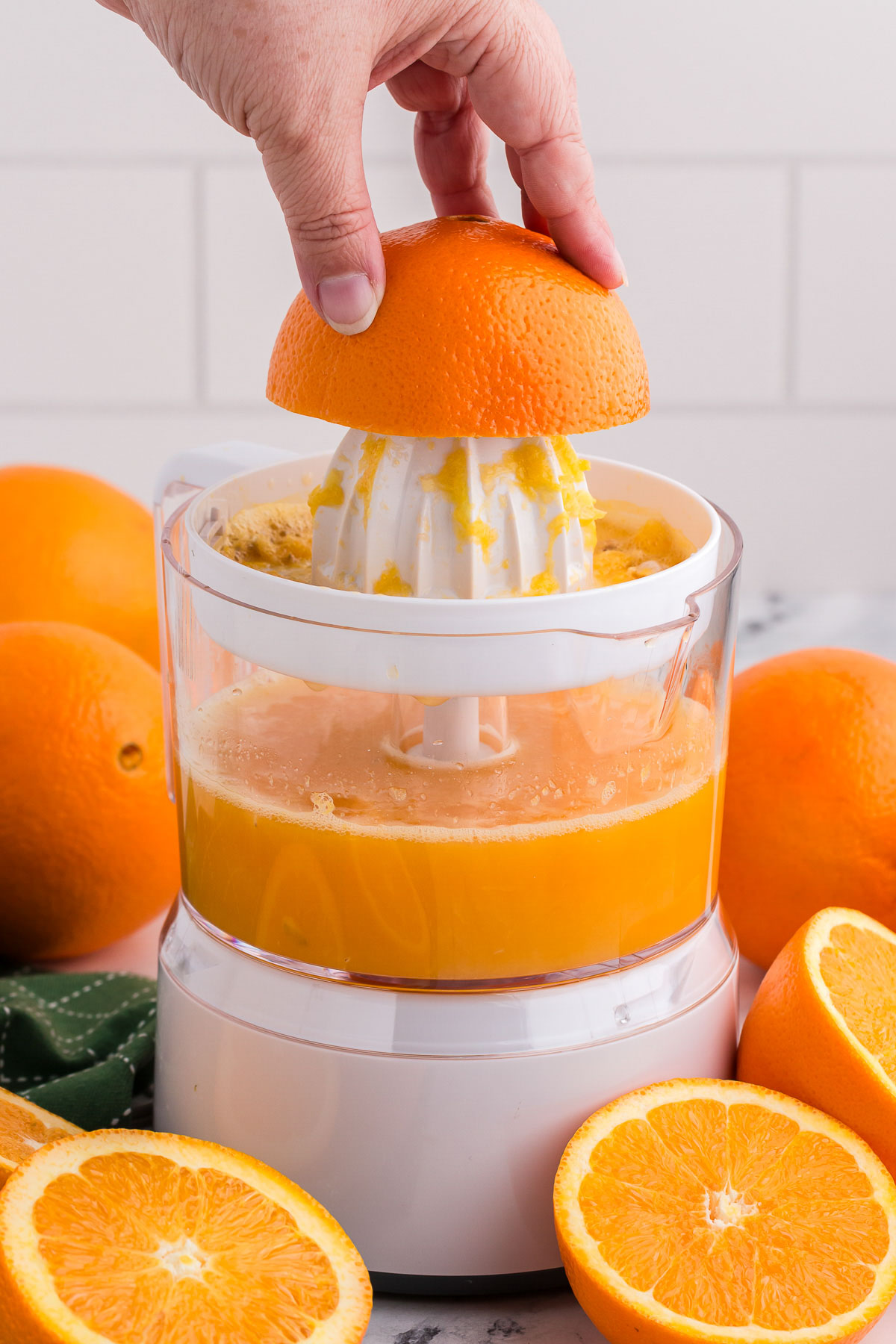 Making fresh squeezed orange juice with an electric juicer