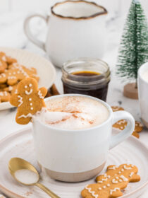 gingerbread latte with a gingerbread cookie propped on top