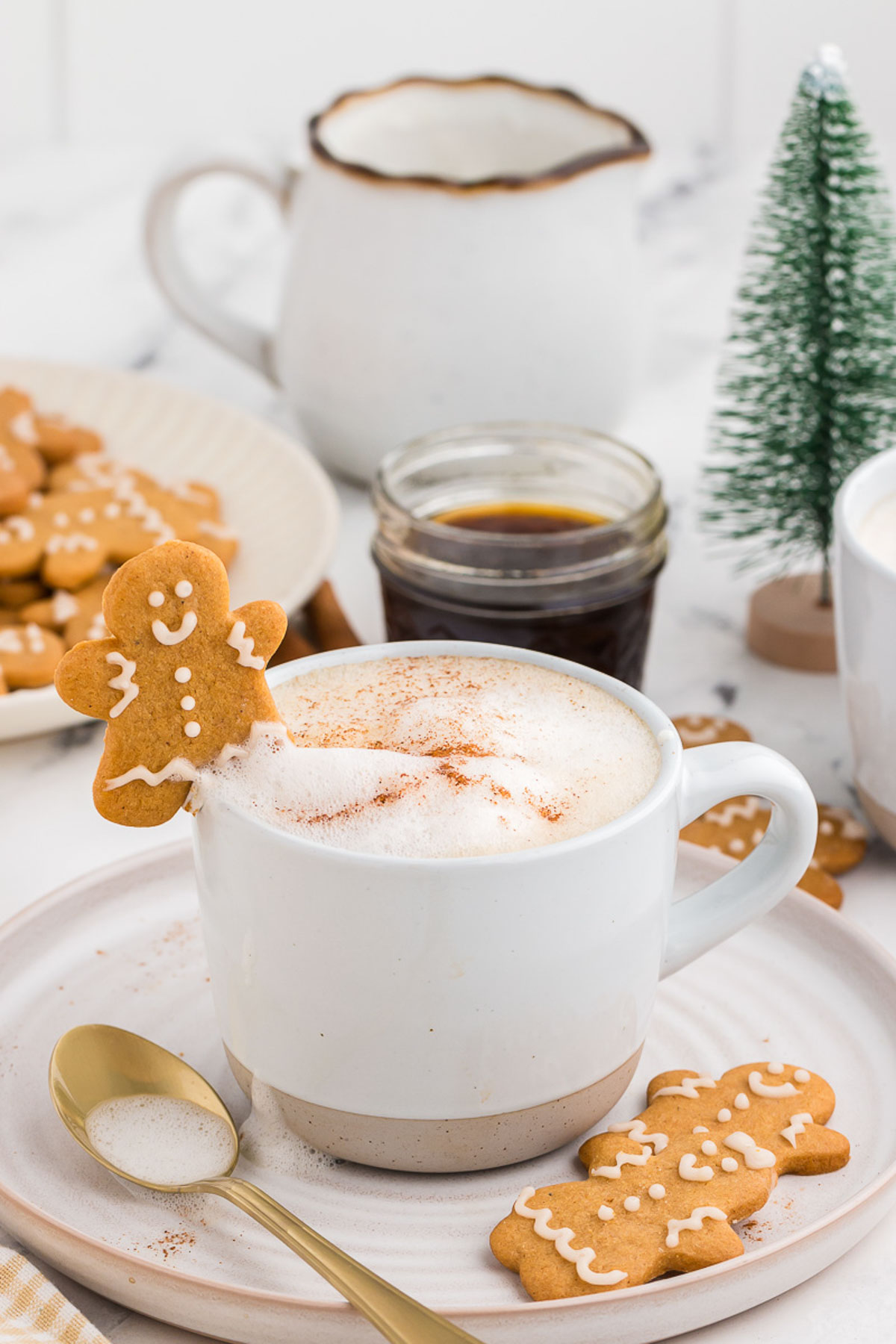 gingerbread latte with a gingerbread cookie propped on top
