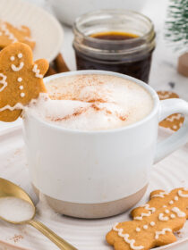 gingerbread latte with a gingerbread cookie propped on top