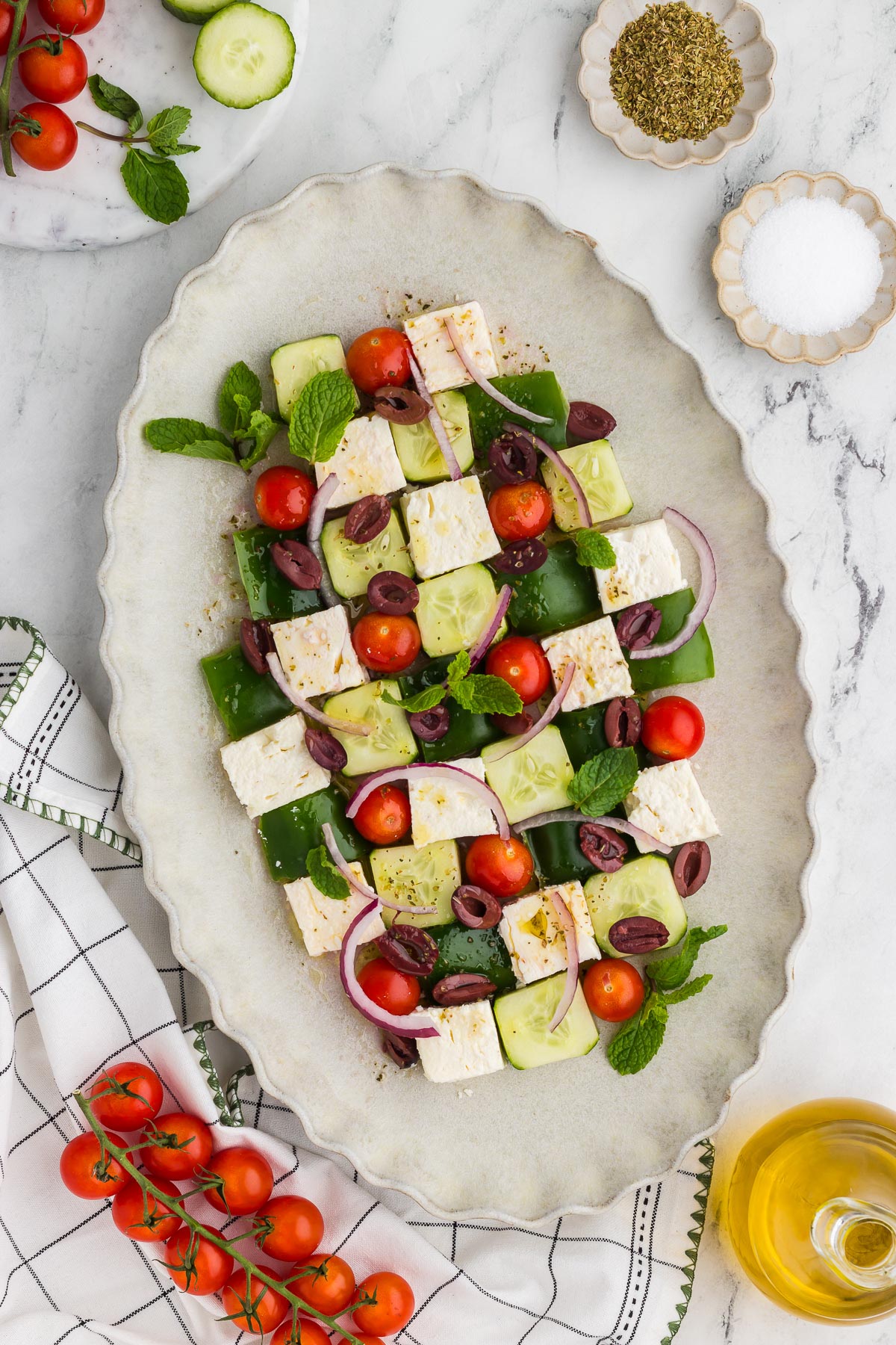 top view of Greek Mosaic Salad with ingredients scattered around