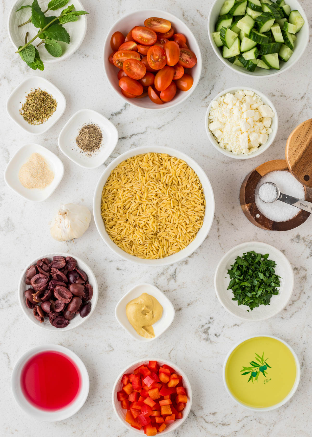 Top view of ingredients for greek orzo pasta salad
