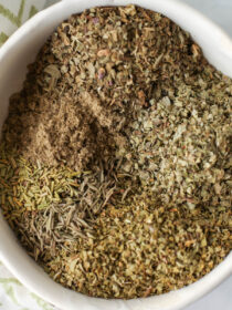 A top view of a bowl of A bowl of Italian Seasoning Mix before mixing.