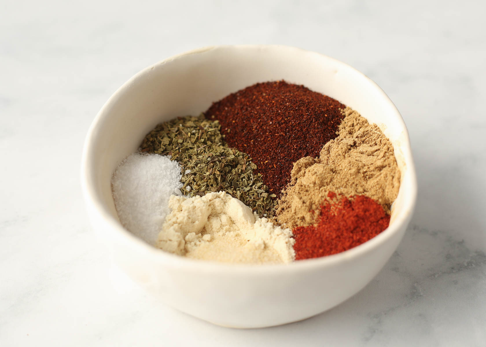 Spices for homemade taco seasoning about to be mixed up.