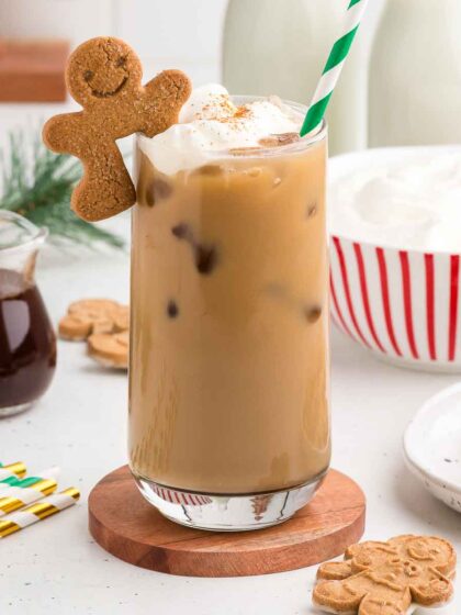 Gingerbread Iced Latte with a gingerbread cookie perched on top