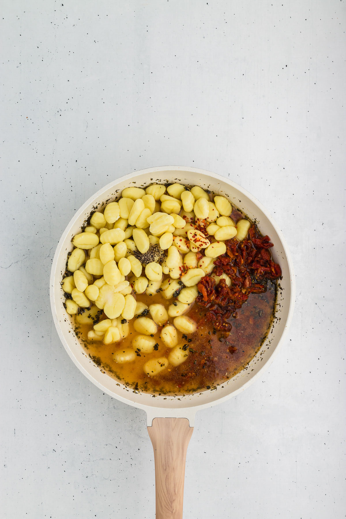 Top view of skillet of marry-me gnocchi being made.
