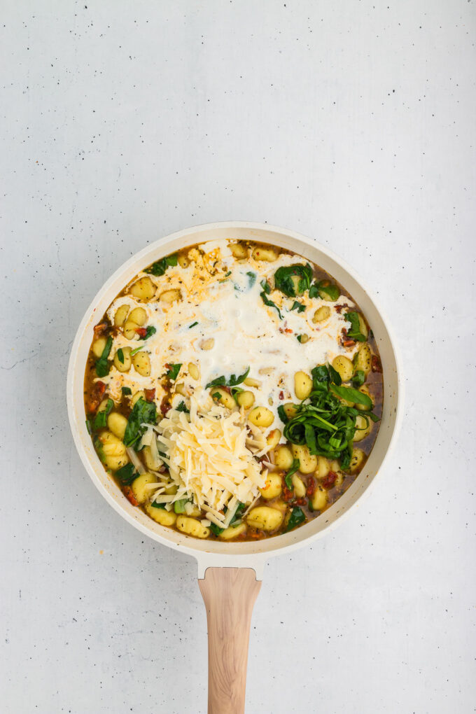 Ingredients for marry-me gnocchi in a skillet.