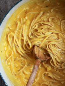 One Pot Creamy Pumpkin Pasta - Luxuriously creamy pumpkin pasta in 20 minutes! It's possible with this super-simple vegetarian one-pot pasta recipe.