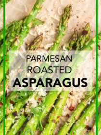 A top view of a white plate lined with parchment paper and parmesan roasted asparagus on top with lemon as garnish. The text reads, "parmesan roasted asparagus."