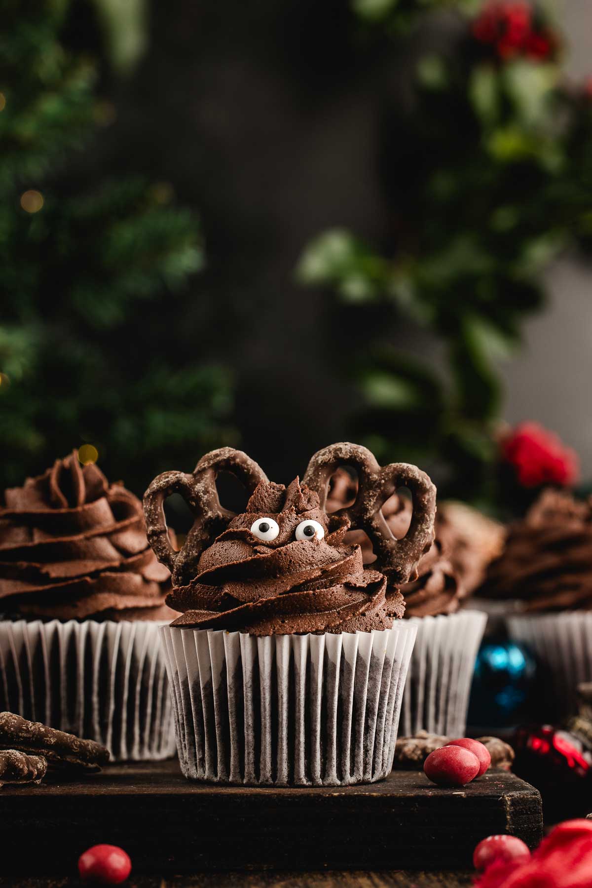 step 3 for frosting reindeer cupcakes: add the candy eyes