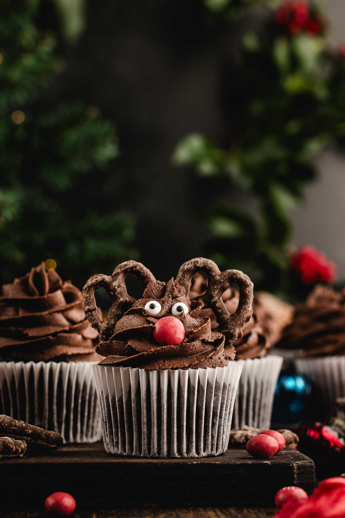 group of reindeer cupcakes with a tree in the background
