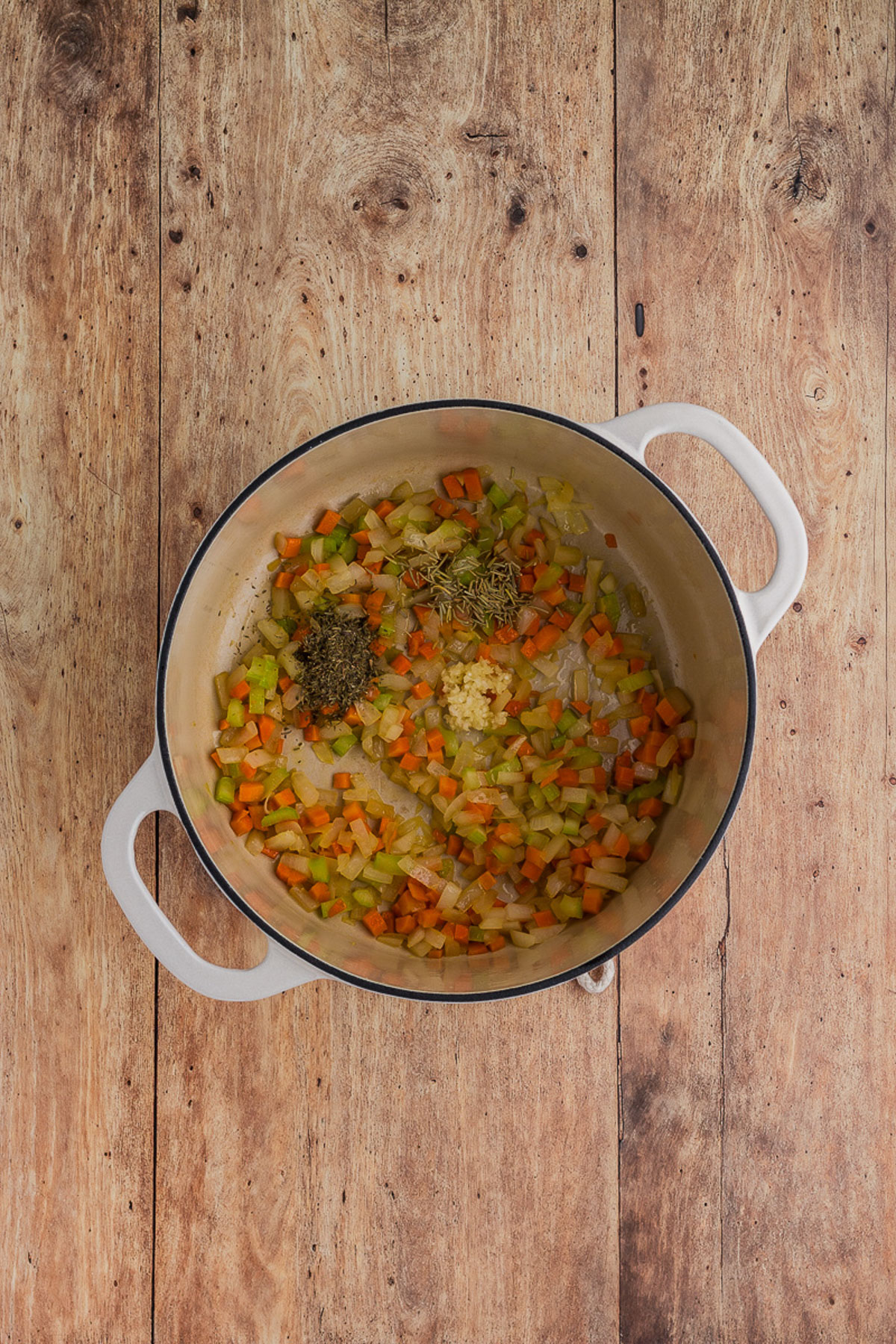 A top view of ribollita in process in a Dutch oven