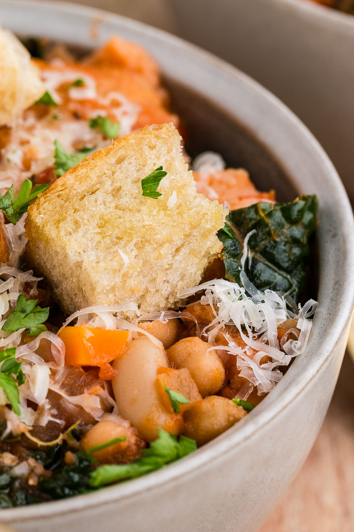 A white bowl full of ribollita