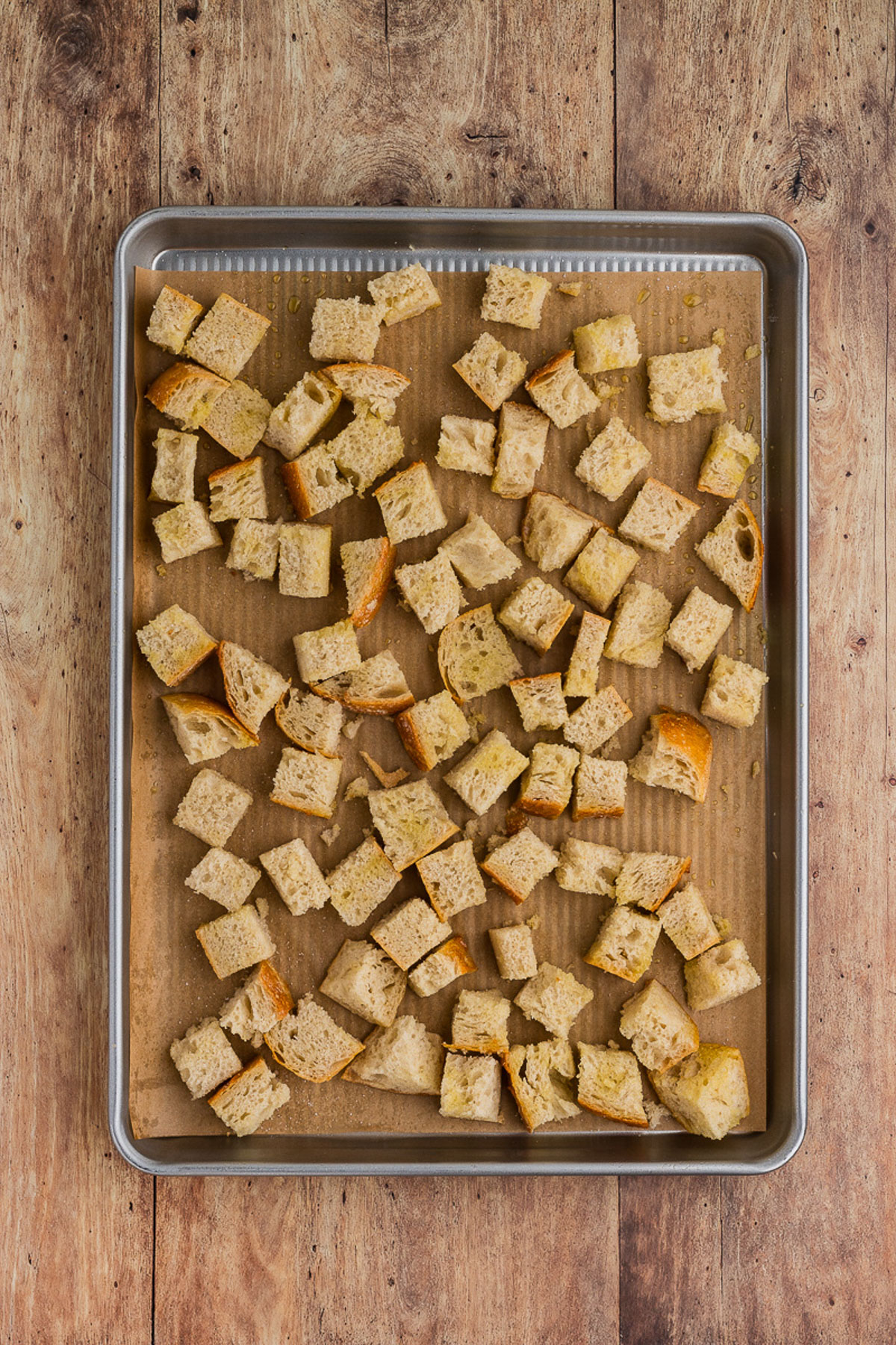 A sheet pan with cubed bread for Tuscan Ribollita