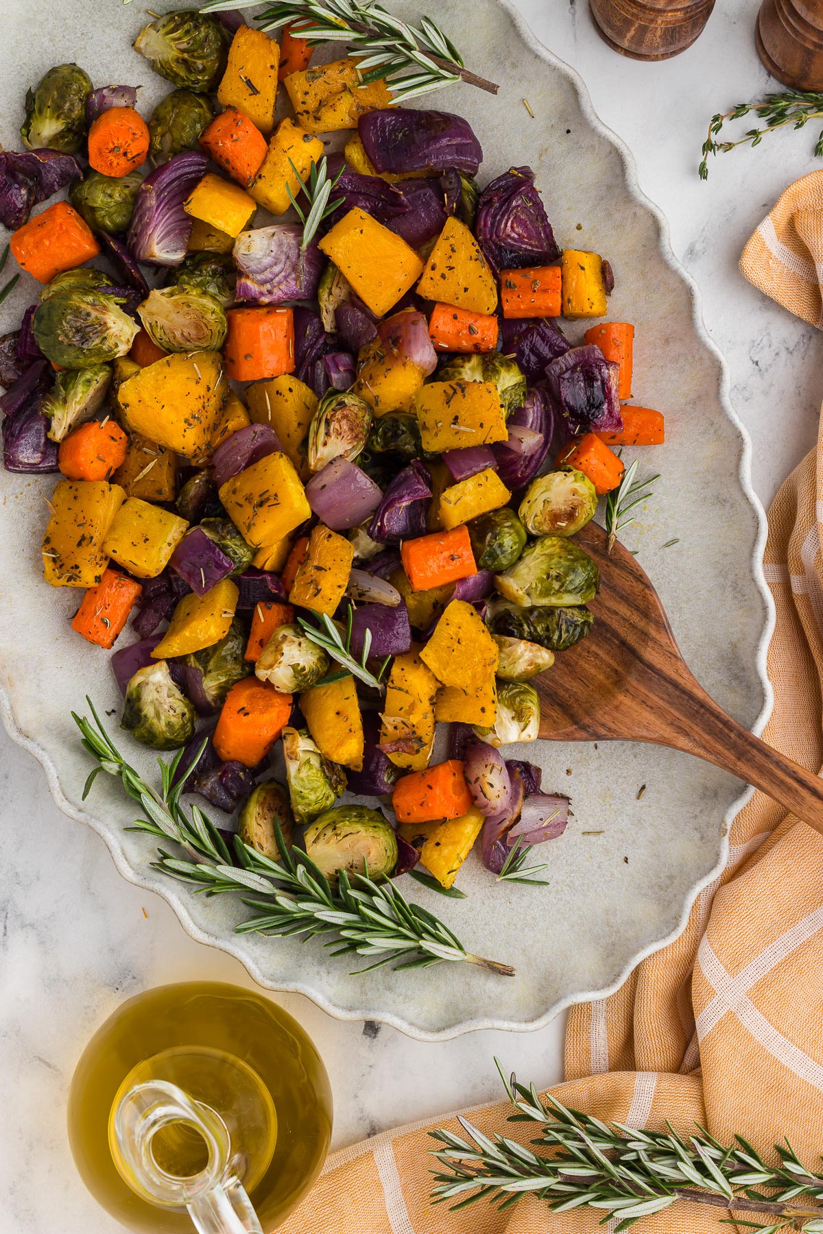 Roasted Fall Vegetables on a plate with a wooden spoon