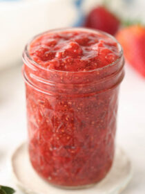 A glass jar full of strawberry chia seed jam