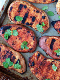 Sweet and Smoky Grilled Sweet Potatoes with Cilantro and Lime - Sweet potatoes on the grill? Heck yes! Thin-sliced sweet potato slabs grill up tender and perfect on the BBQ. Rub 'em with spices and top with cilantro and lime for the side of the summer.
