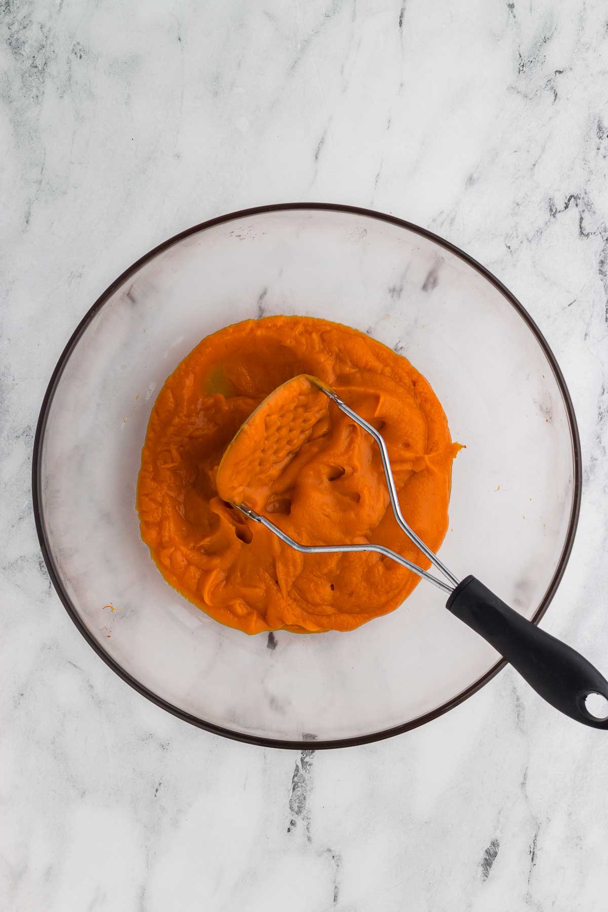 mashing sweet potato for Spiced Sweet Potato Cake