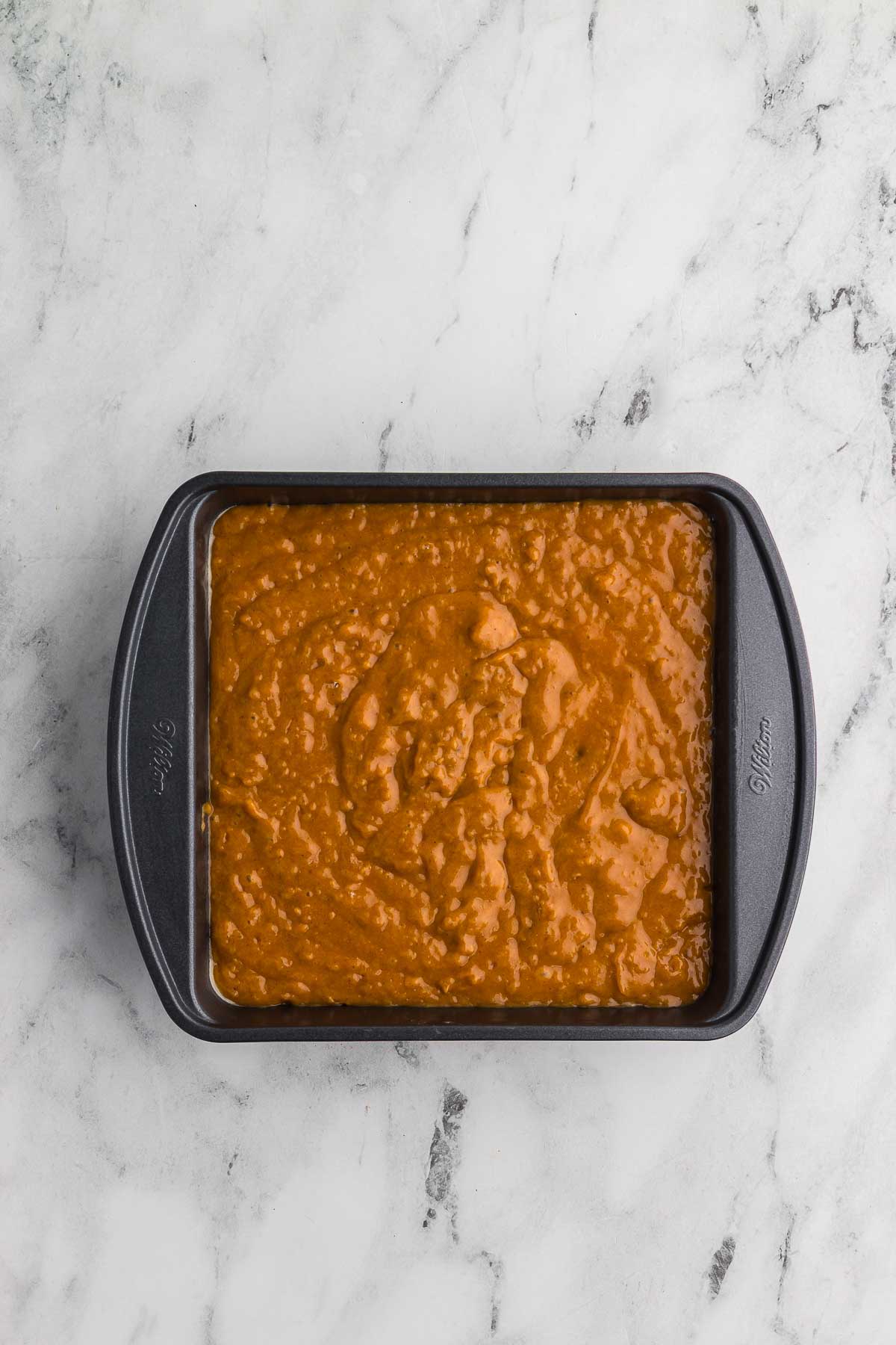 Spiced Sweet Potato Cake batter in an 8x8 pan