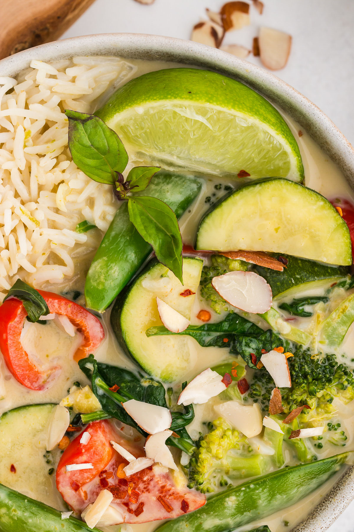 Top view of a bowl full of Thai green curry.