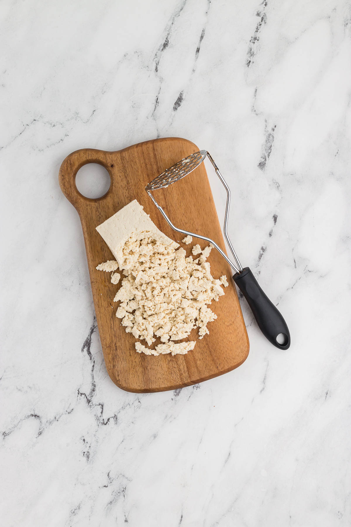 smashing tofu for tofu fried rice